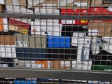 many boxes of electronic devices in a metal cage