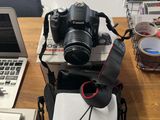 two laptops and a camera on a table