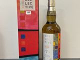 une image d'une bouteille de whisky à côté d'une boîte