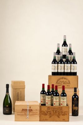 several bottles of wine and boxes of wine on a white surface