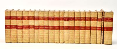 books are lined up in a row on a white surface
