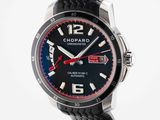 a close up of a black watch with a red second hand
