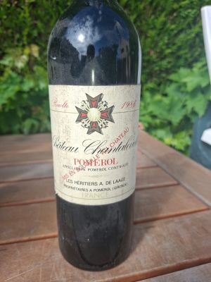 a bottle of wine that is sitting on a table