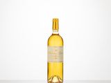 a bottle of white wine sitting on top of a table