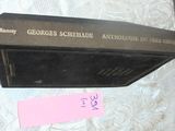 a book on a table with a pink label on it