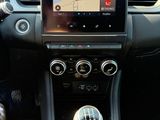 the dashboard of a car with a gps device in the center of it