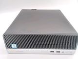 an image of a computer with a keyboard and mouse on a white surface