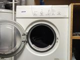 a washer and dryer in a small room