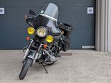 a motorcycle parked in front of a garage door