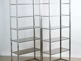 pair of chrome and glass bookcases