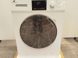 an image of a washing machine sitting on top of a wooden pallet