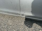 a shadow of a person on the side of a car