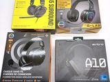 three boxes of gaming headsets sitting on top of a white surface