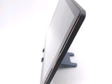a tablet that is sitting on a stand on the table