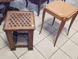 two tables and two stools in a room