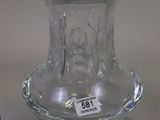 a glass vase sitting on a table with a price tag on it