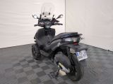 a scooter that is parked in a room
