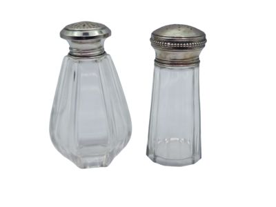 pair of salt and pepper shakers on a white background