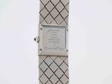 a close up of a wrist watch on a white surface