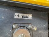 a close up of a yellow vehicle with a sign on it