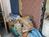 a pile of wood sitting on a pallet in a room