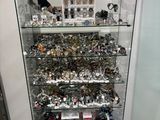 a glass display case with a lot of items in it