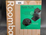 a box of roombaby plus 406 with the box open
