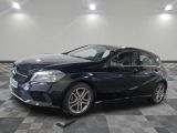 the mercedes b - class is parked in a large room with a checkered floor