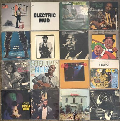 an image of a collection of various vinyl records on a wall