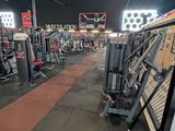 a gym with a lot of machines in it
