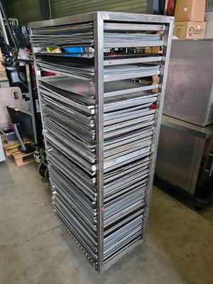 several trays of food are stacked on top of each other in a warehouse