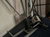 a laptop computer sitting on top of a metal table