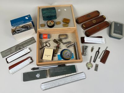 a wooden box filled with assorted items on a table