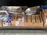 a cart full of boxes and other items sitting on the floor