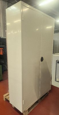 an image of a large white cabinet in a warehouse
