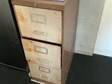 a filing cabinet with a file cabinet on top of it