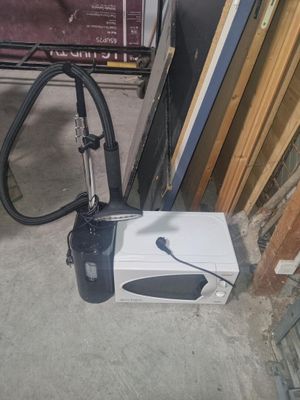 a white box with a black handle sitting on the floor