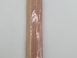 a bag of straws sitting on a white table