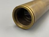 an image of a brass pipe on a white surface
