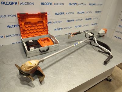 a tool that is sitting on a table next to a tool case