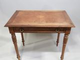 an old wooden table with a drawer on top of it