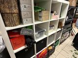 a room with a bunch of boxes on the shelves