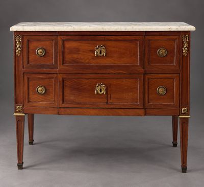 an antique chest of drawers with marble top
