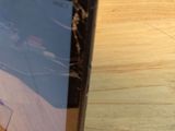 a tablet computer sitting on top of a wooden table