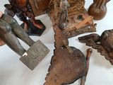 a lot of wooden statues that are on a table