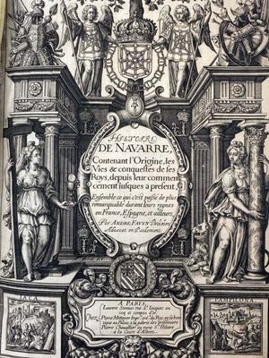 an old book with a picture of a group of people on top of it