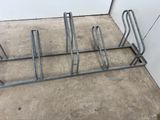 a metal rack that has been placed on the floor