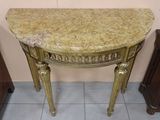 a marble top table with a drawer underneath it