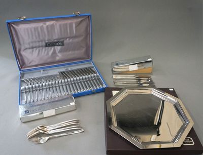 silverware and silverware in a case on a table
