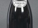 a bottle of wine that is sitting on a table